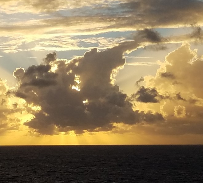 Streaming Sunset above ocean waters