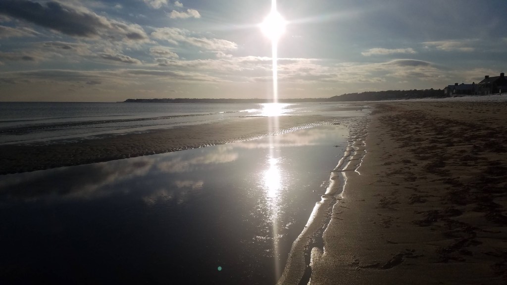 Low tide uncovering a sand bar at the beach