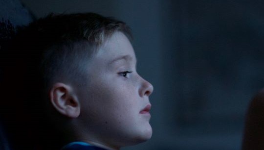 Worried boy leaning his head back