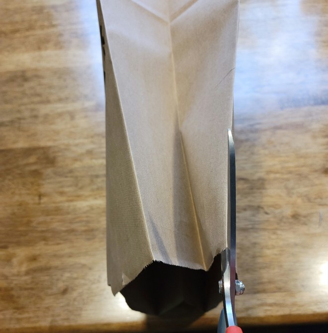 Cutting down side fold of paper bag