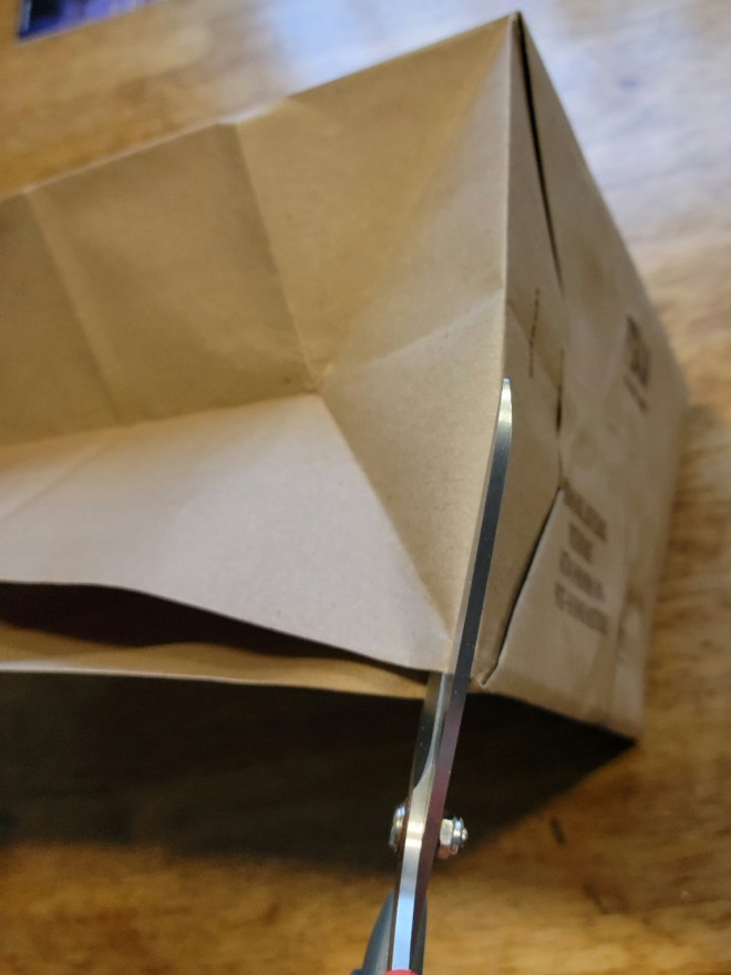 Cutting out bottom of paper bag