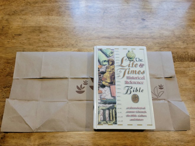 Hardcover book on folded paper bag cover