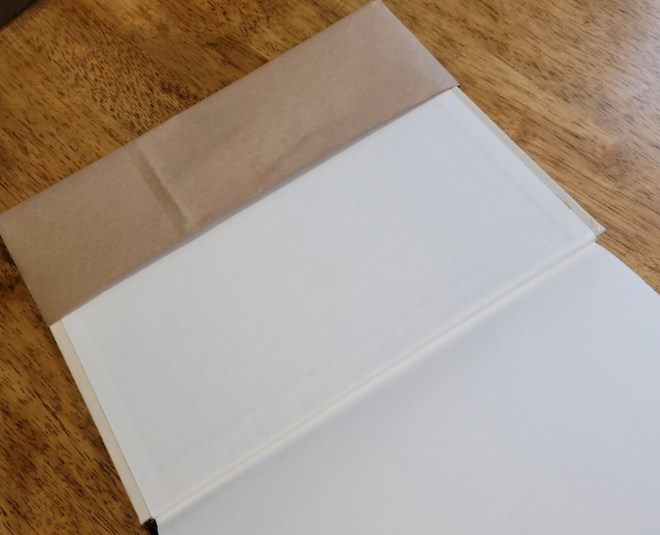 Book cover tucked in paper book cover flaps