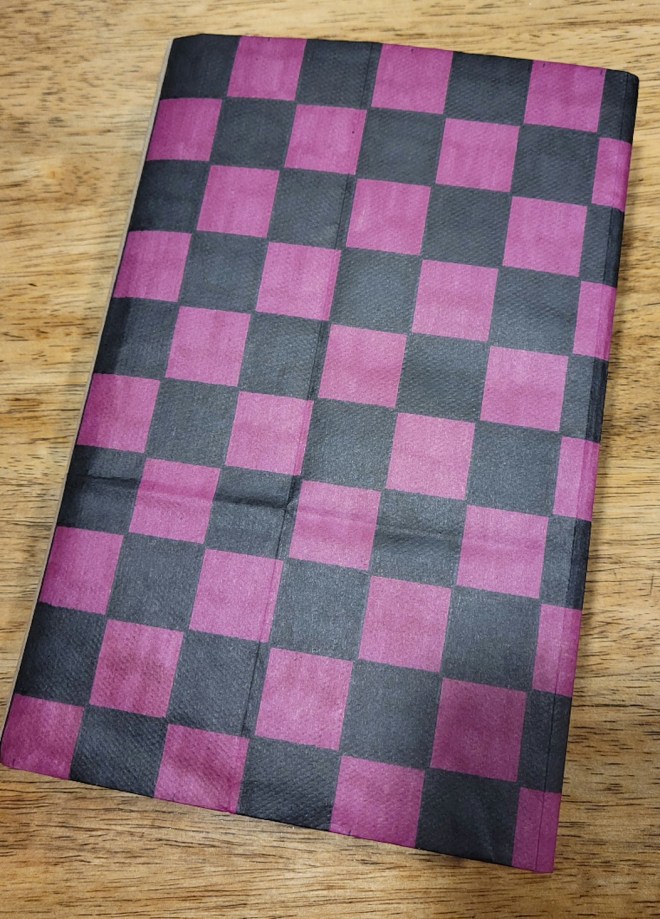 Pink and black checkerboard paper bookcover