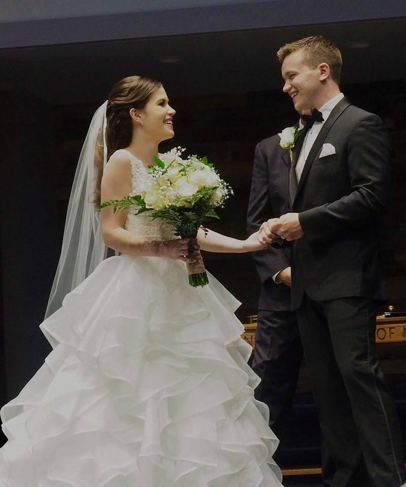 Bride and Groom smiling at one another