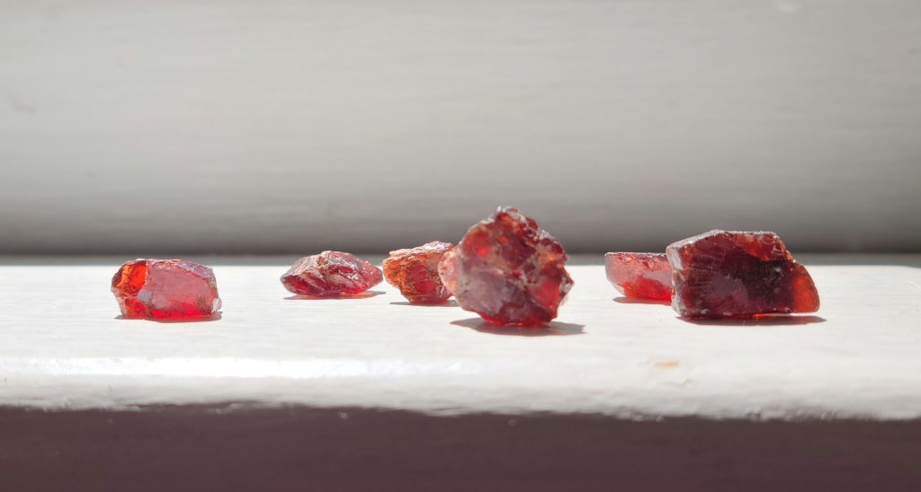 Rough garnets on a sunny windowsill