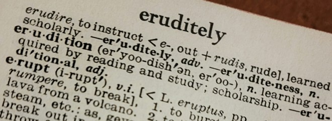 Close up of eruditely entry on a dictionary page