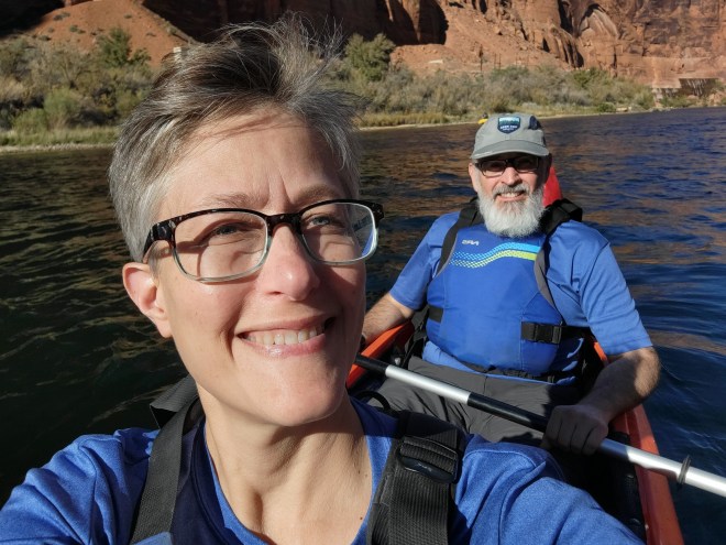 Man and woman kayaking in Marble Canyon on the Colorado River