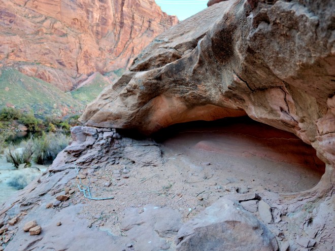 Closeup of small cave caused by wind erosion in canyon wall