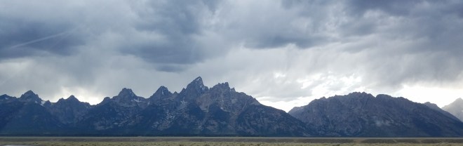 Harsh mountain peaks outlined by stormy skies