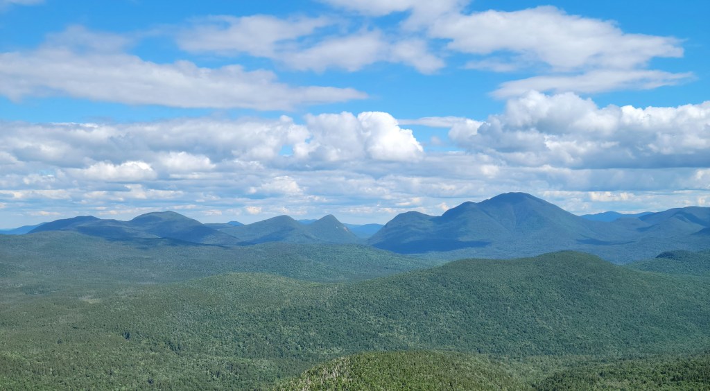 View of green mountaintops from another mountain